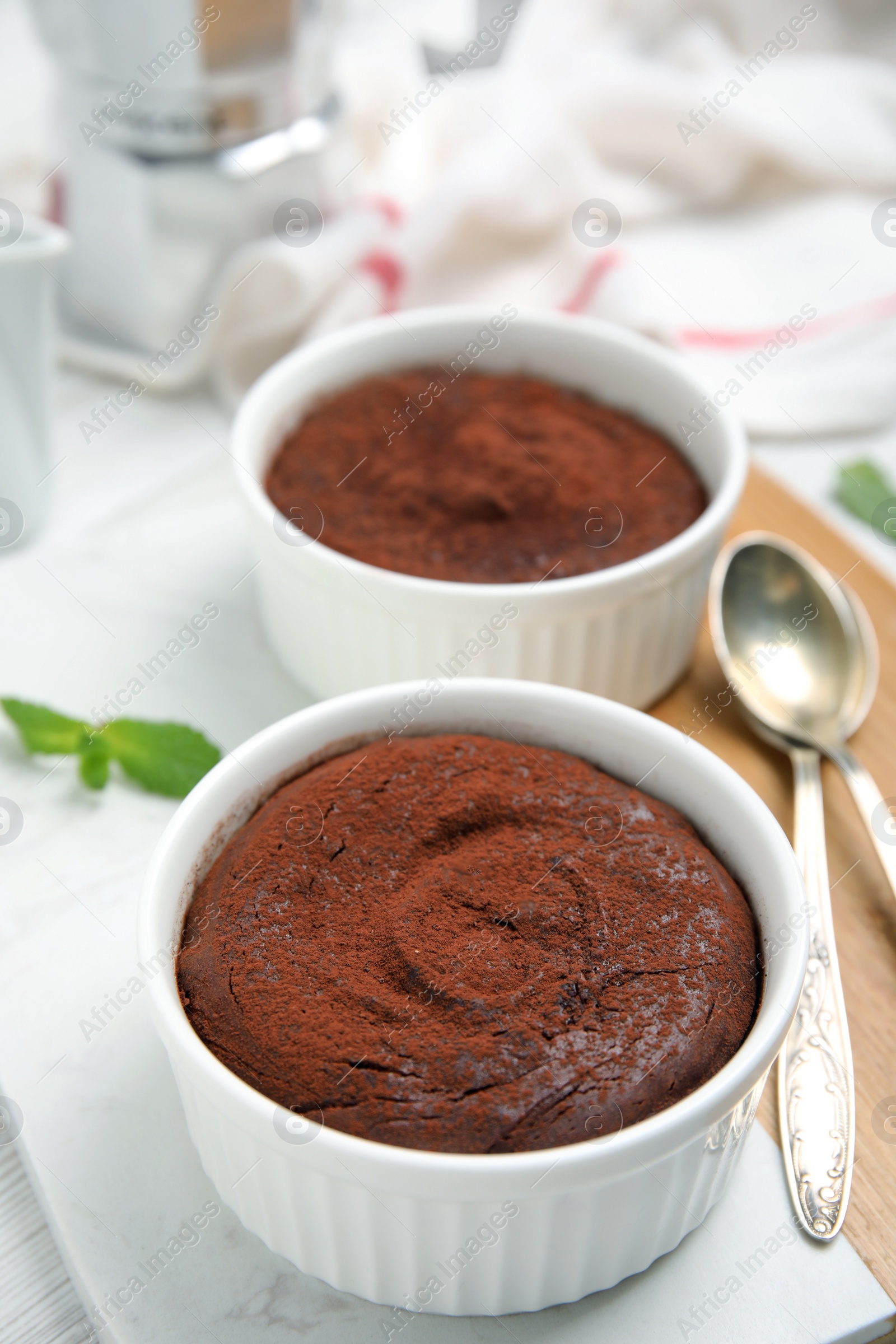 Photo of Delicious fresh chocolate fondant on white table