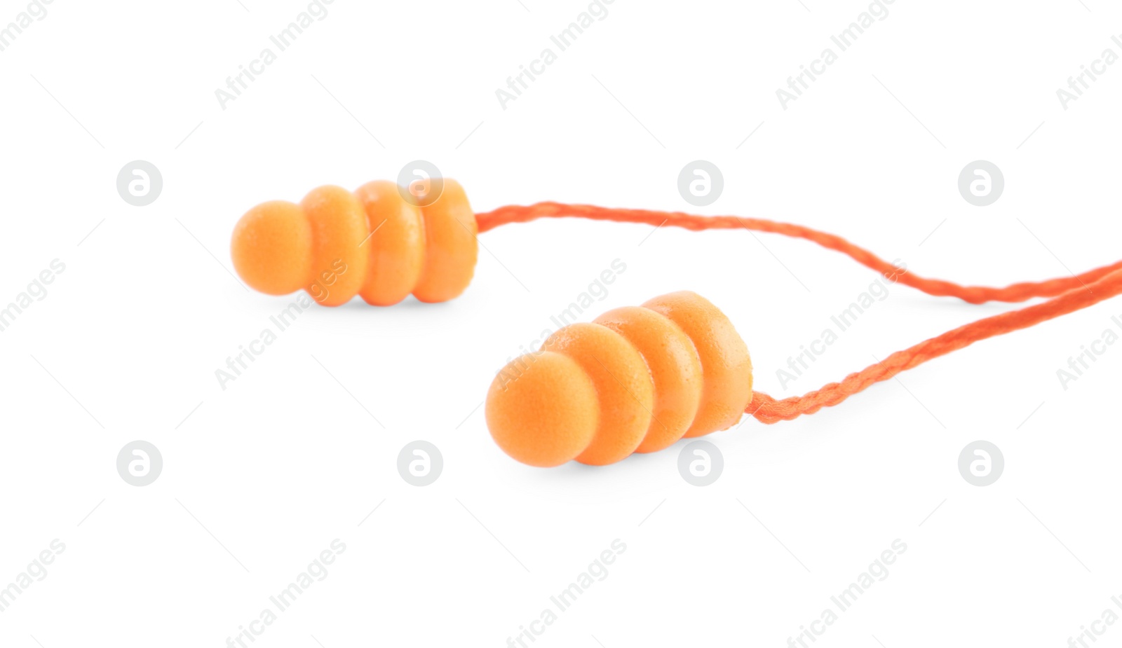 Photo of Pair of orange ear plugs isolated on white