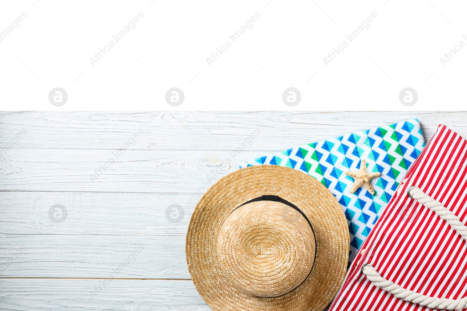 Photo of Flat lay composition with beach accessories on wooden background. Space for text