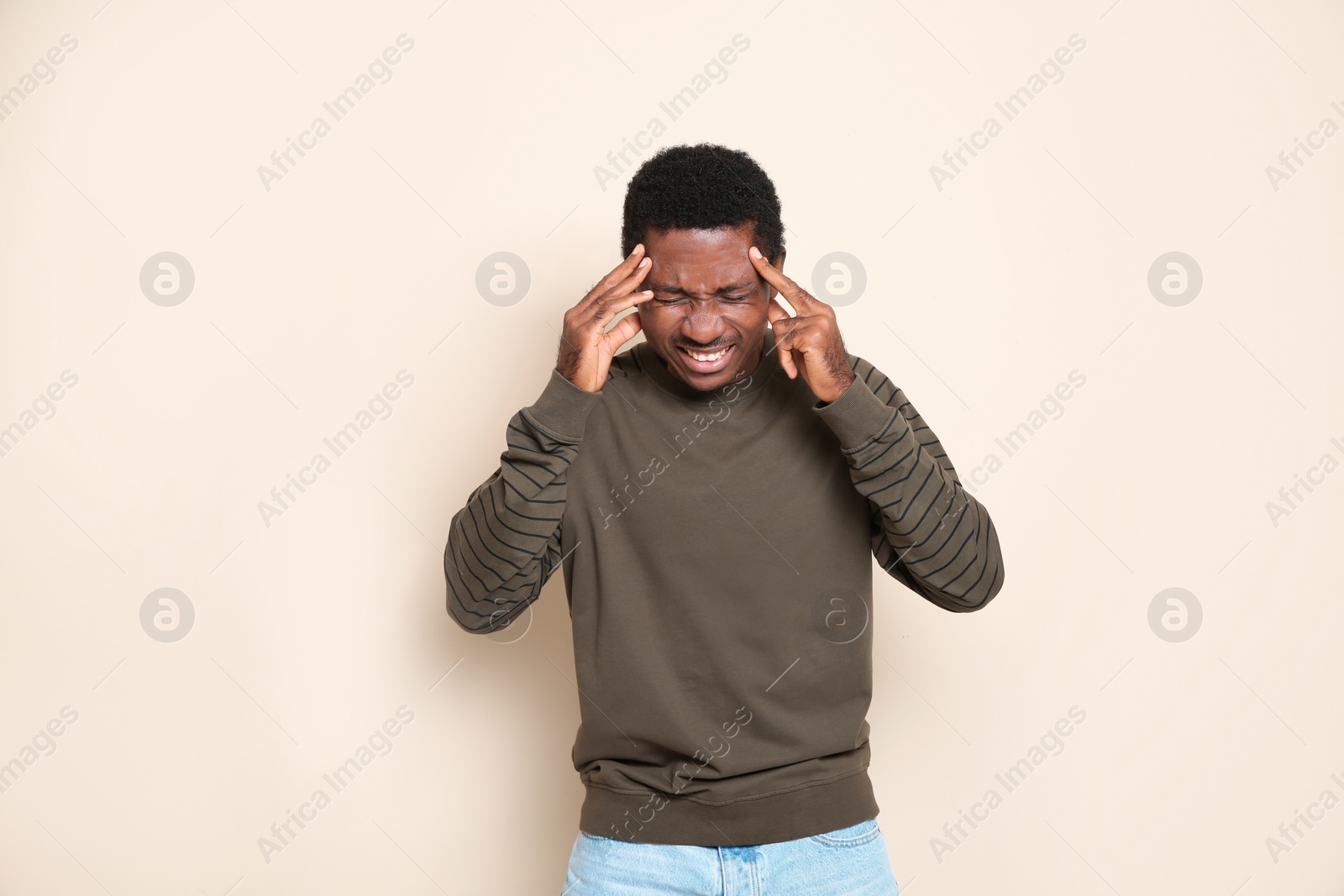 Photo of Portrait of thoughtful African-American man on color background