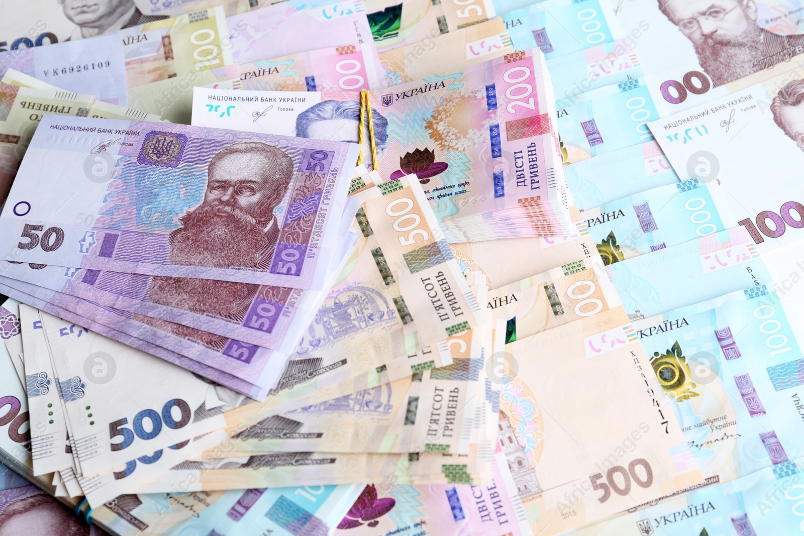 Photo of Closeup view of Ukrainian money as background. National currency