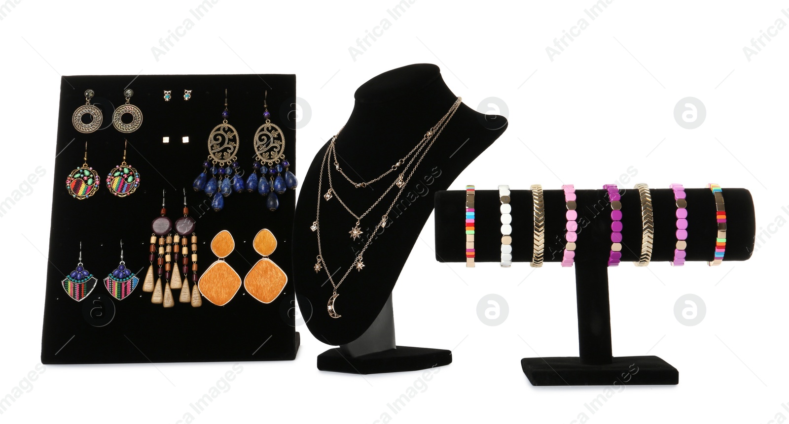 Photo of Different display stands with stylish jewelry on white background