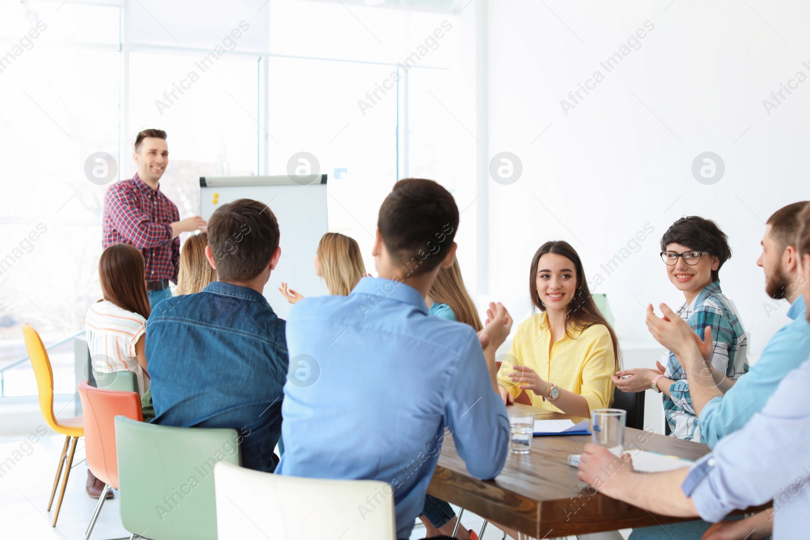 Photo of Male business trainer giving lecture in office