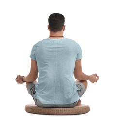 Photo of Man meditating on white background, back view