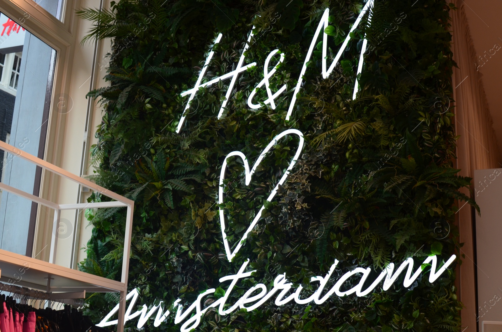 Photo of Amsterdam, Netherlands - June 18, 2022: H&M fashion store logo on building outdoors