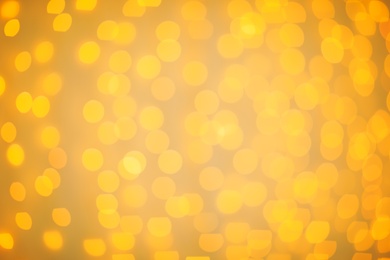 Photo of Beautiful gold lights as background. Bokeh effect