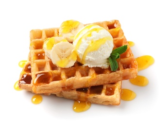 Photo of Delicious waffles with ice cream, banana and syrup on white background