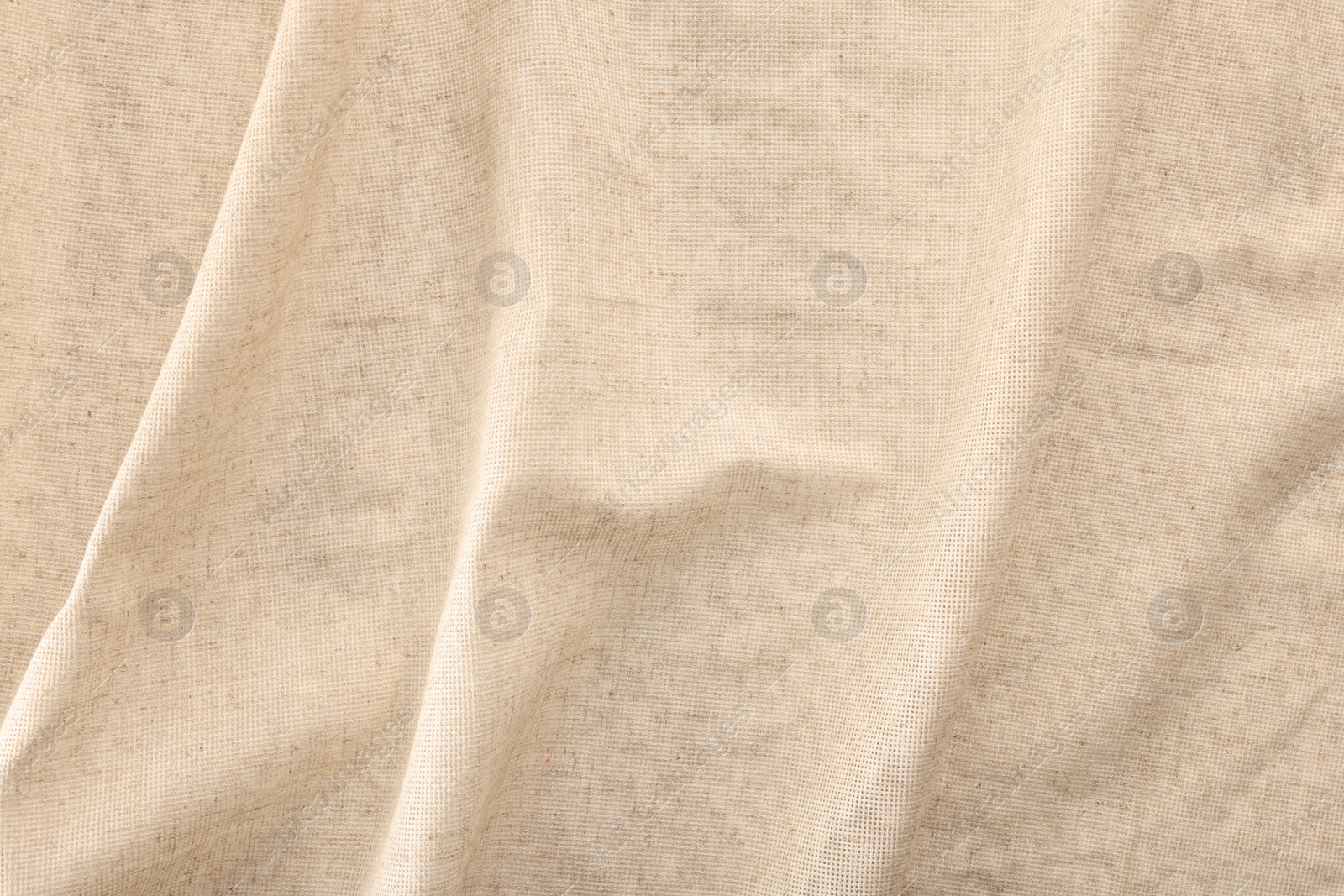 Photo of Texture of natural burlap fabric as background, top view