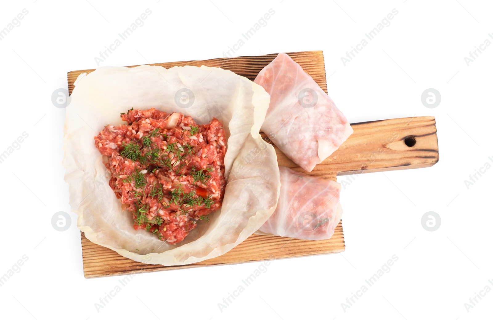 Photo of Wooden board with stuffed cabbage rolls isolated on white, top view