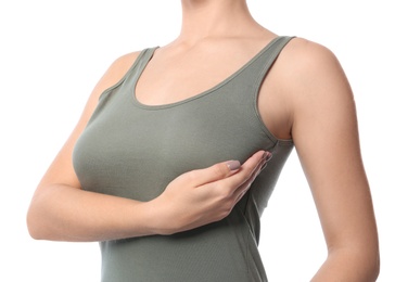 Photo of Woman checking her breast on white background, closeup