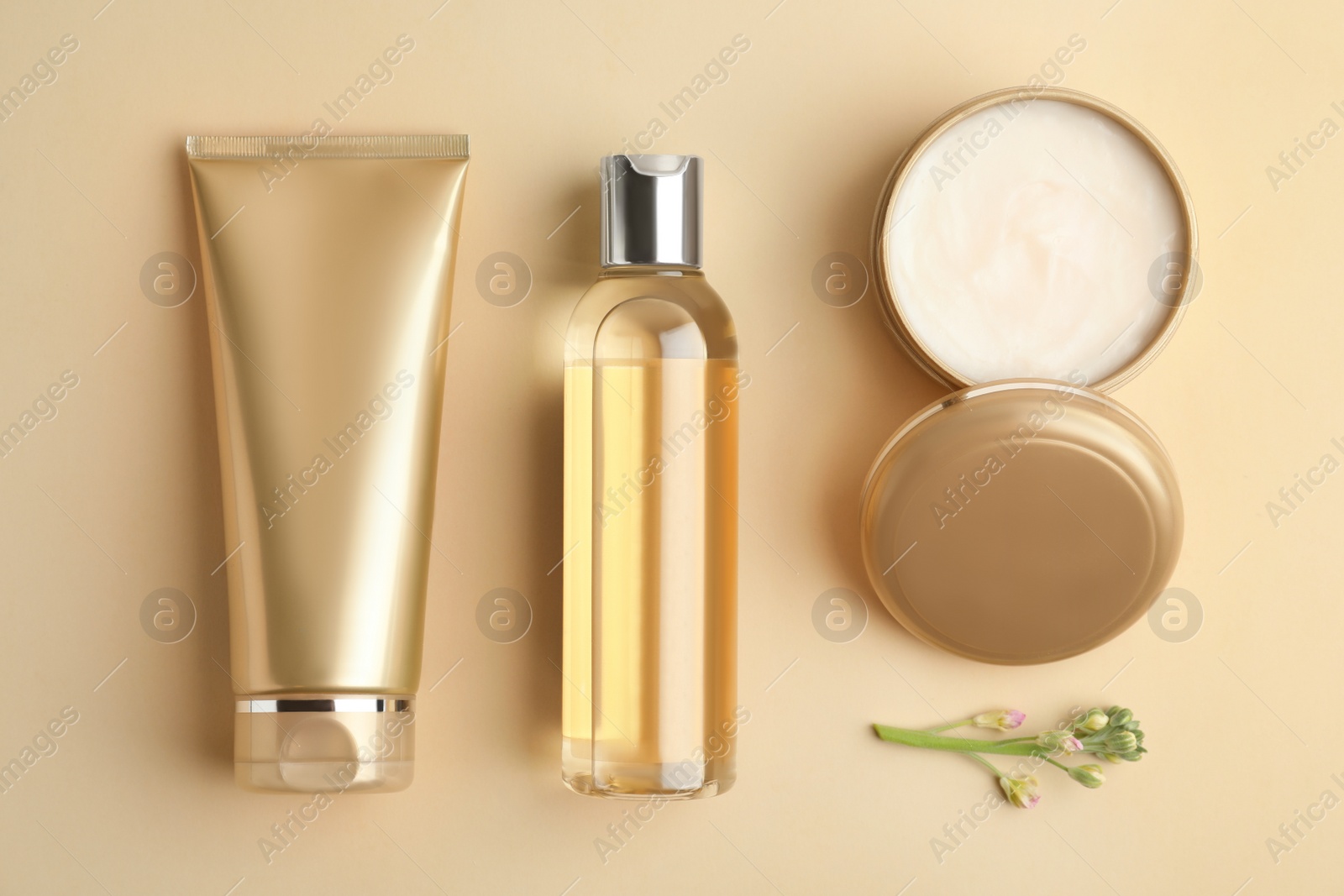 Photo of Flat lay composition with cosmetic products on beige background