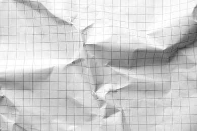 Photo of Crumpled sheet of paper as background, closeup