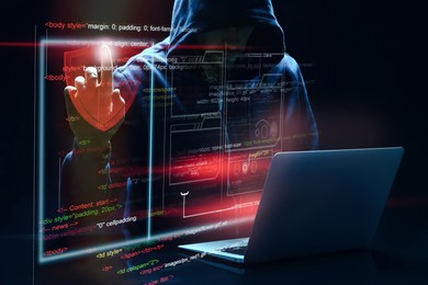 Image of Man with laptop and digital code on dark background. Cyber attack concept