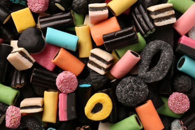 Photo of Many different liquorice candies as background, top view