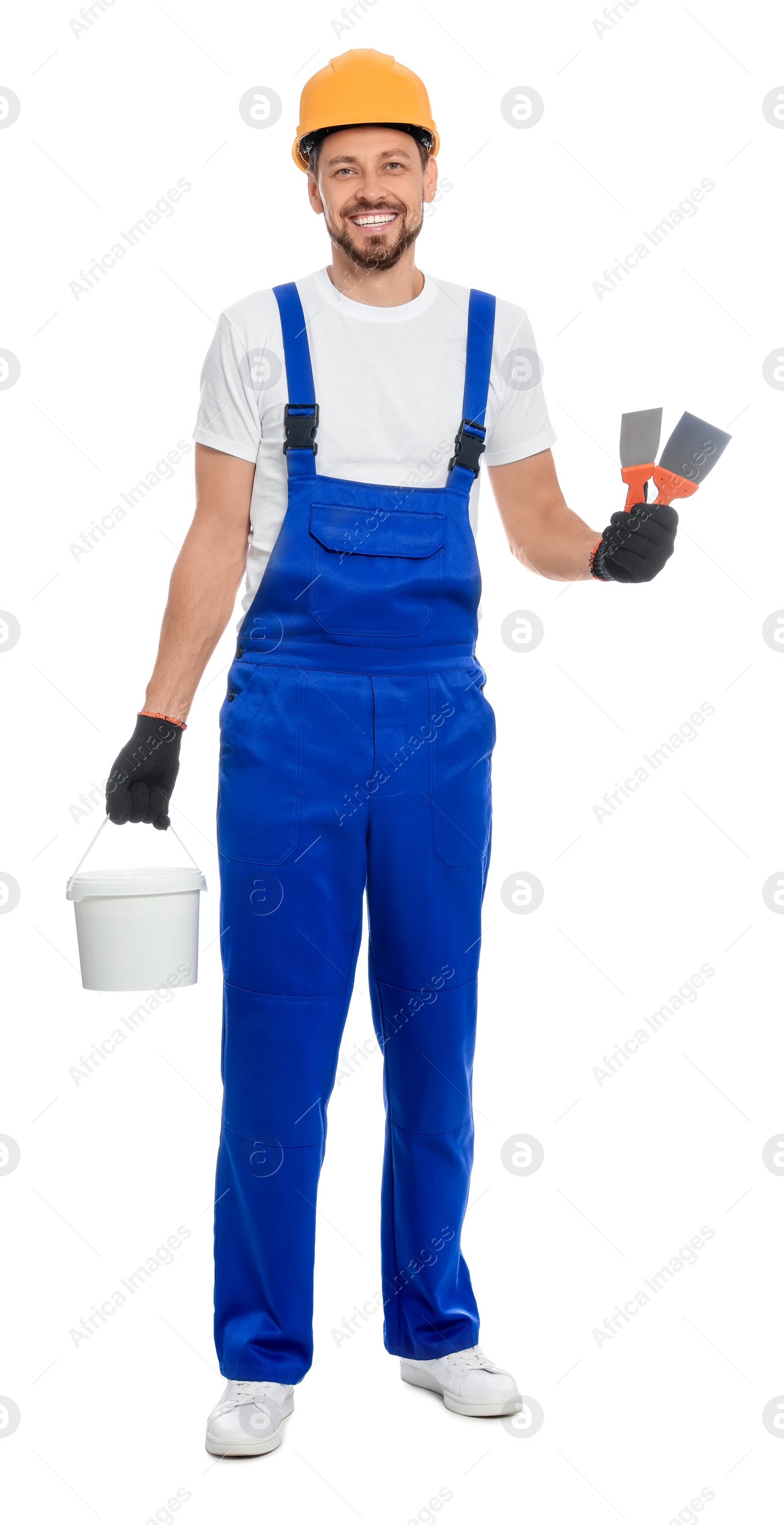 Photo of Professional worker with putty knife and plaster in hard hat on white background