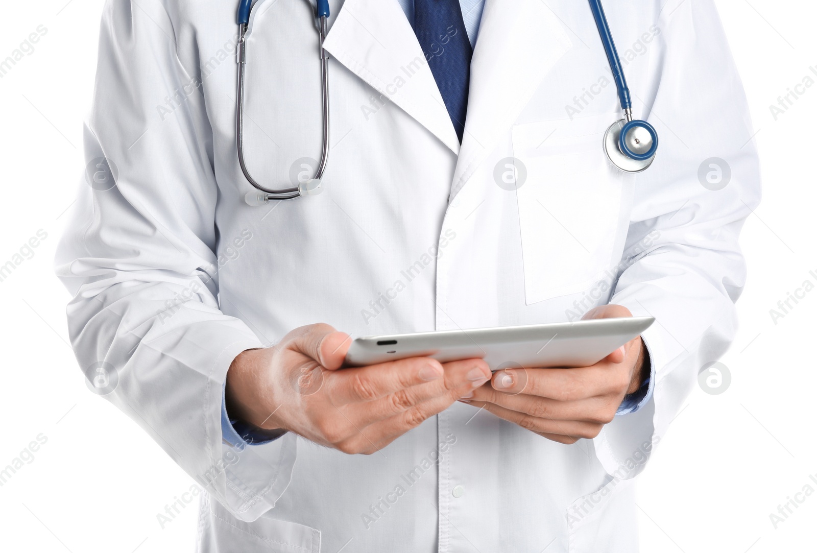 Photo of Male doctor holding modern tablet on white background, closeup