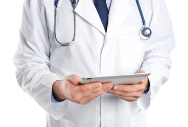 Photo of Male doctor holding modern tablet on white background, closeup