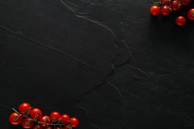 Photo of Food photography. Fresh cherry tomatoes on black table, flat lay with space for text