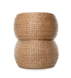 Photo of Two stylish wicker poufs on white background