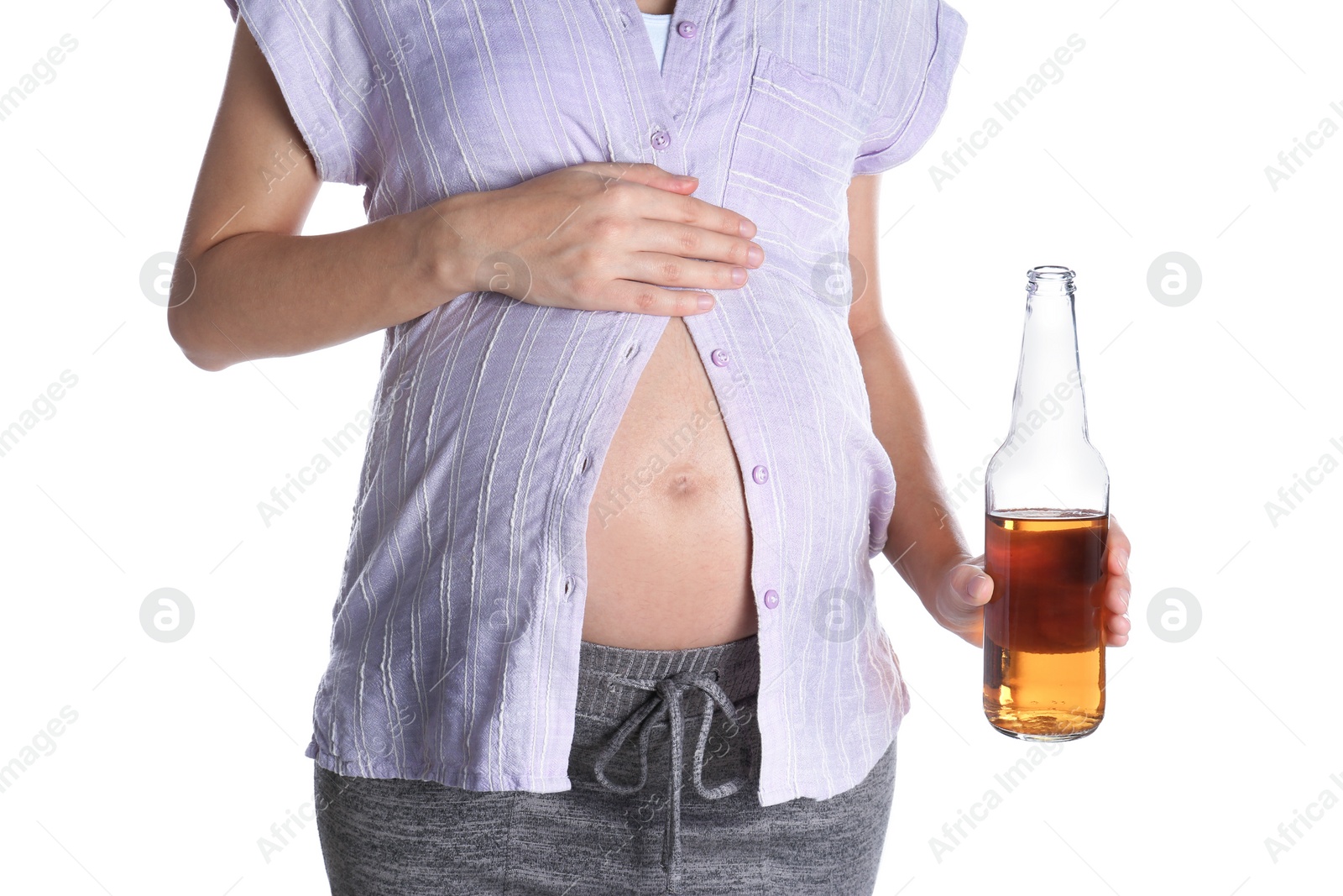 Photo of Pregnant woman with bottle of whiskey on white background. Alcohol addiction