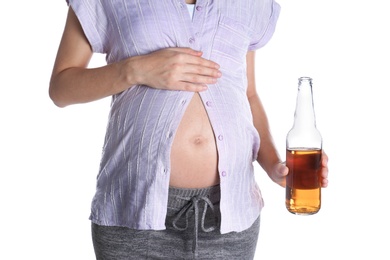 Photo of Pregnant woman with bottle of whiskey on white background. Alcohol addiction