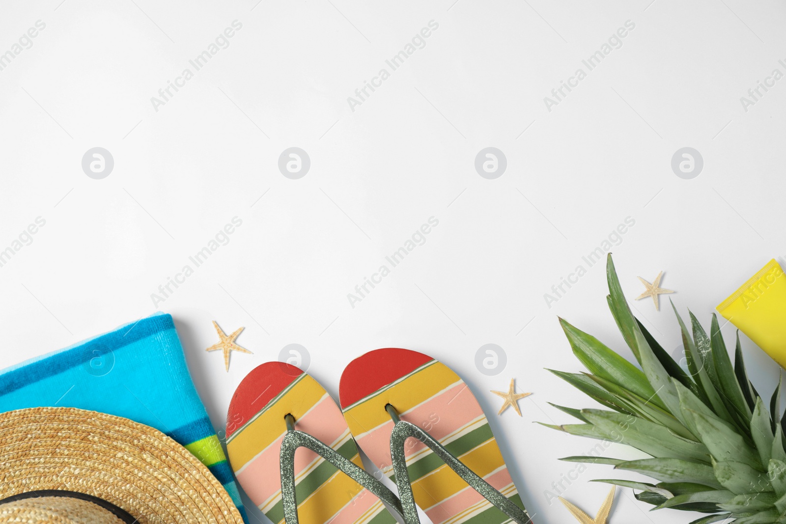 Photo of Beach accessories on white background, top view. Space for text