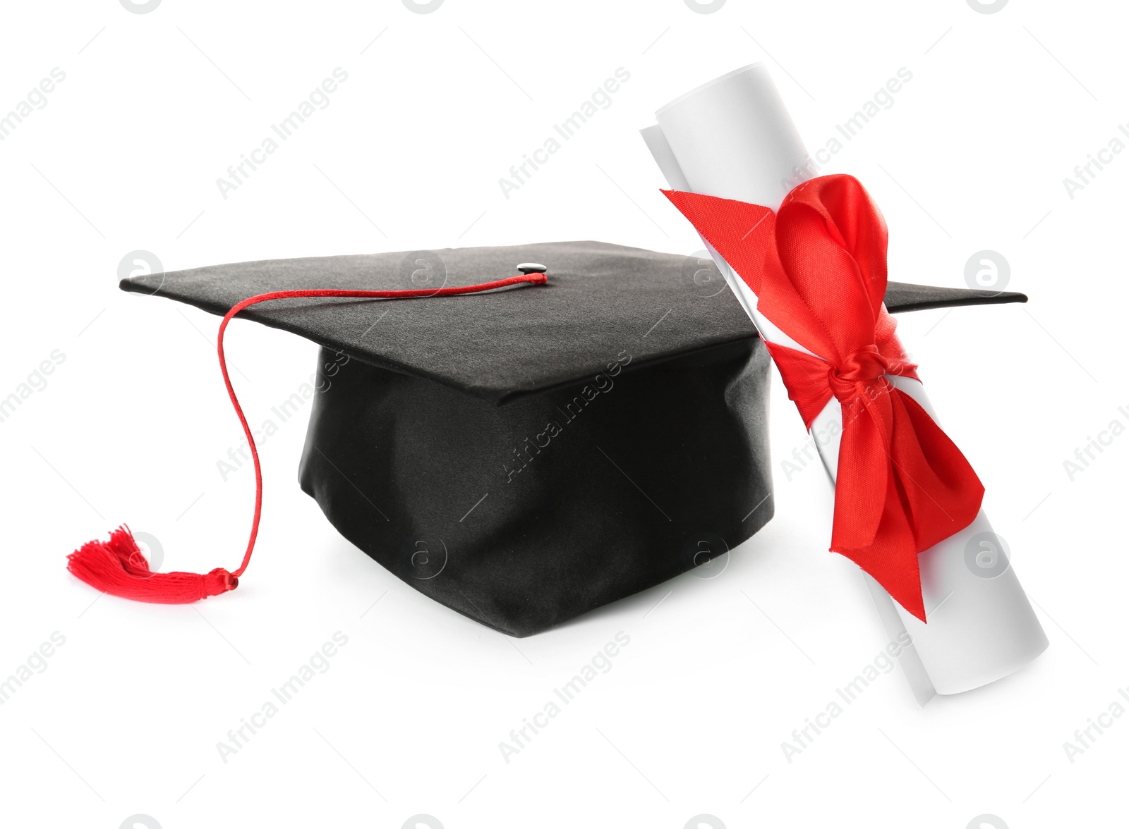 Photo of Graduation hat and diploma on white background