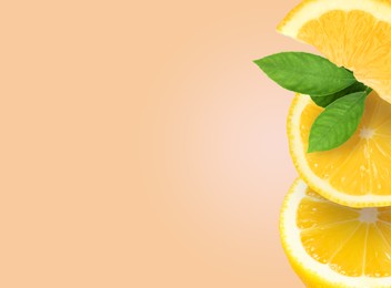 Image of Stack of cut fresh lemons with leaves on pale coral background, space for text