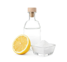 Photo of Baking soda, vinegar and lemon on white background