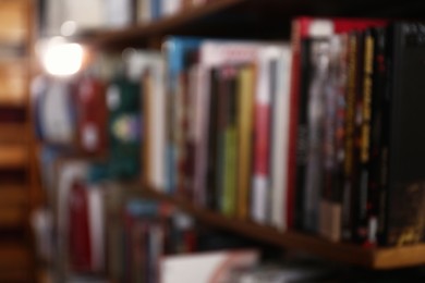 Photo of Blurred view of different books on shelves in library