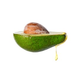 Fresh avocado with dripping oil on white background