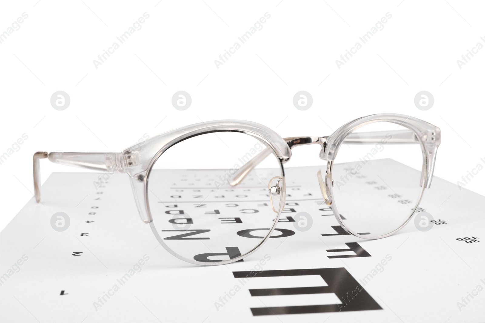 Photo of Glasses and vision test chart isolated on white