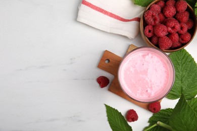 Tasty raspberry smoothie in glass and fresh berries on white marble table, flat lay. Space for text