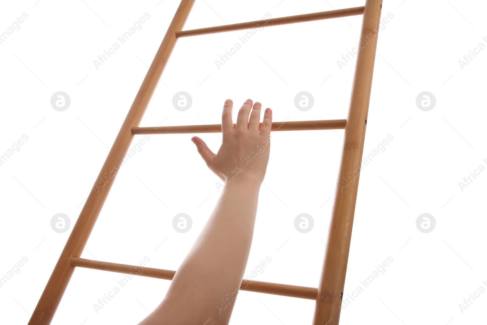 Photo of Woman climbing up wooden ladder against white background, closeup