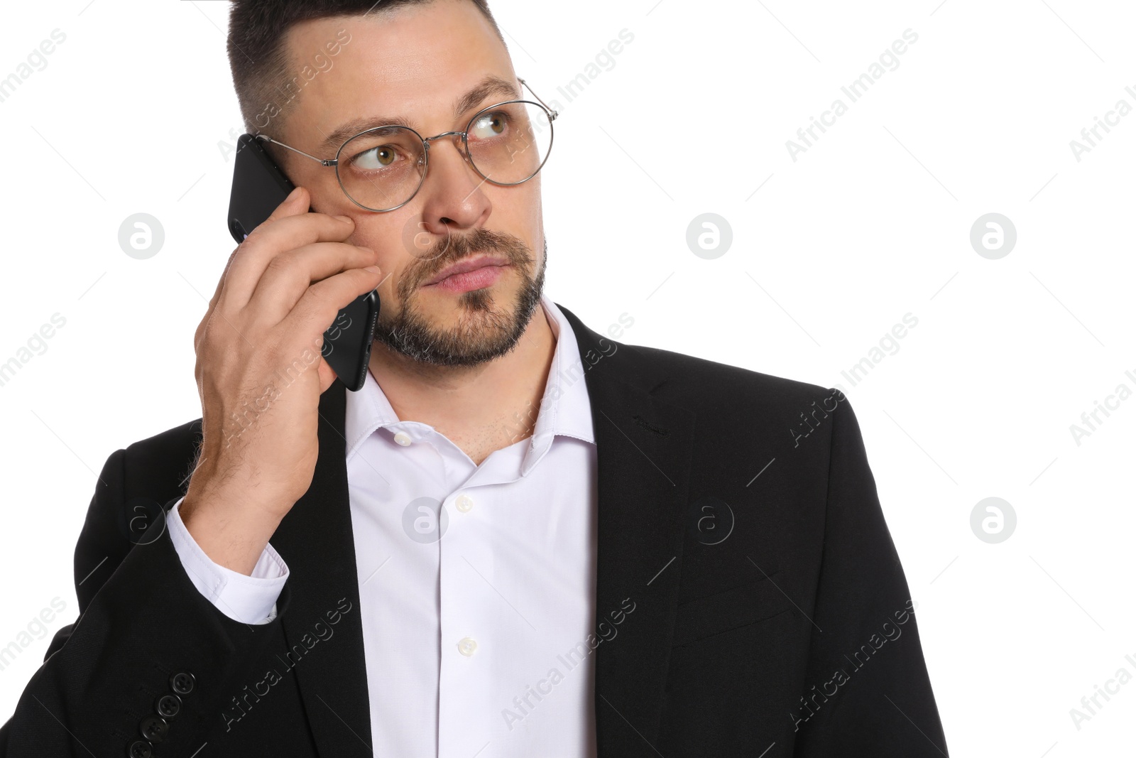 Photo of Businessman in glasses talking on smartphone against white background, closeup