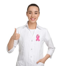 Photo of Mammologist with pink ribbon showing thumbs up on white background. Breast cancer awareness