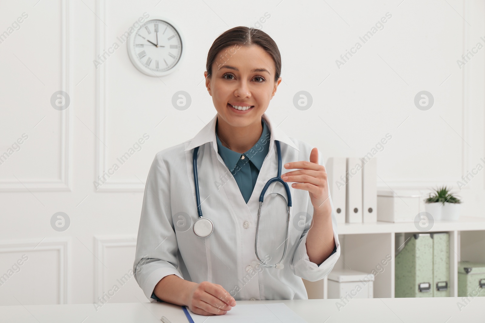 Photo of Pediatrician consulting patient using video chat in clinic, view from webcam