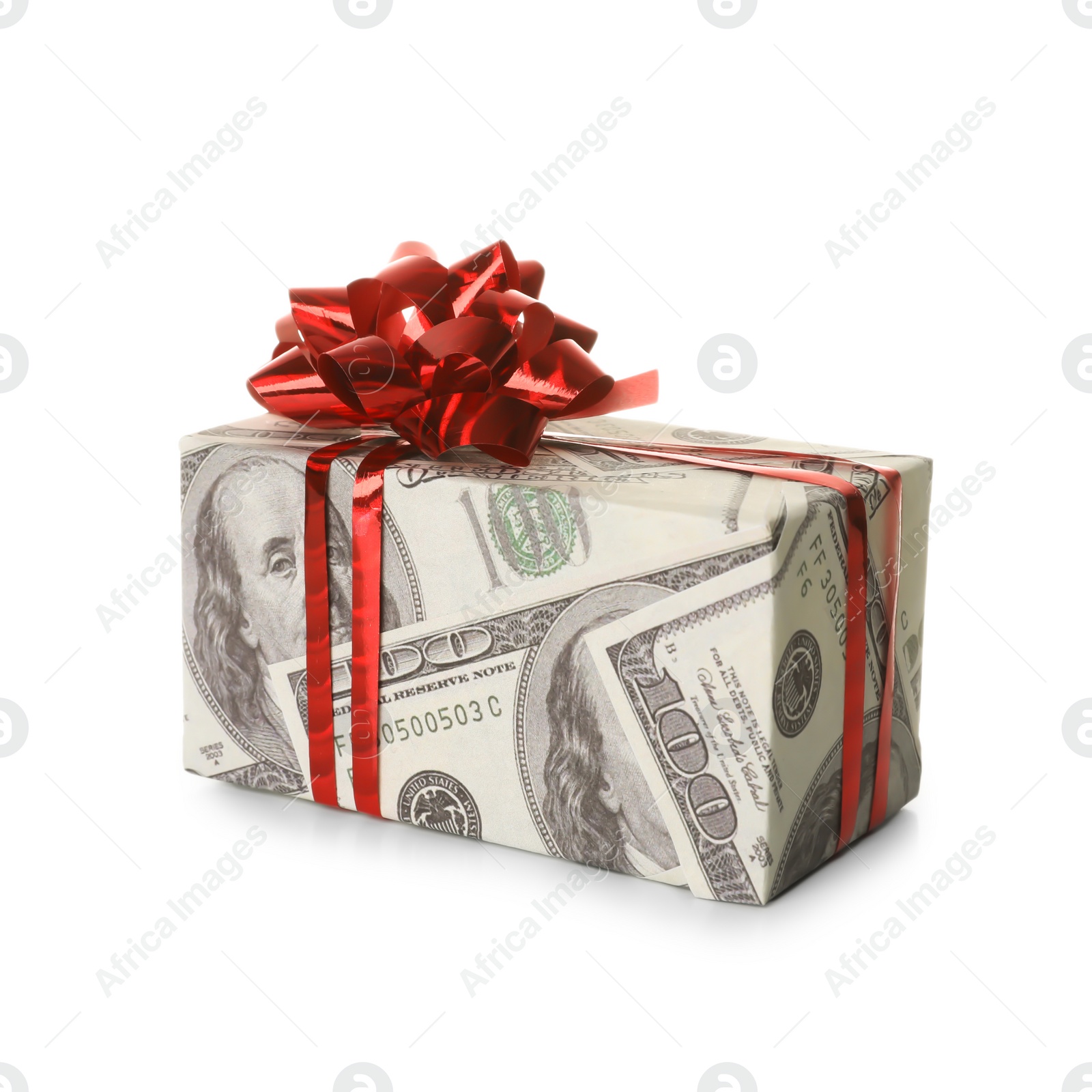 Photo of Gift box wrapped in decorative paper with dollar pattern on white background