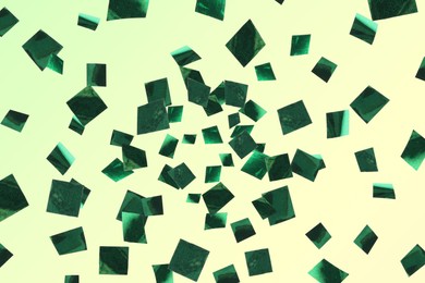 Image of Shiny green confetti falling on color background