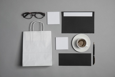 Photo of Flat lay composition with stationery on grey background. Mock up for design