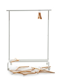 Photo of Wardrobe rack with wooden hangers on white background