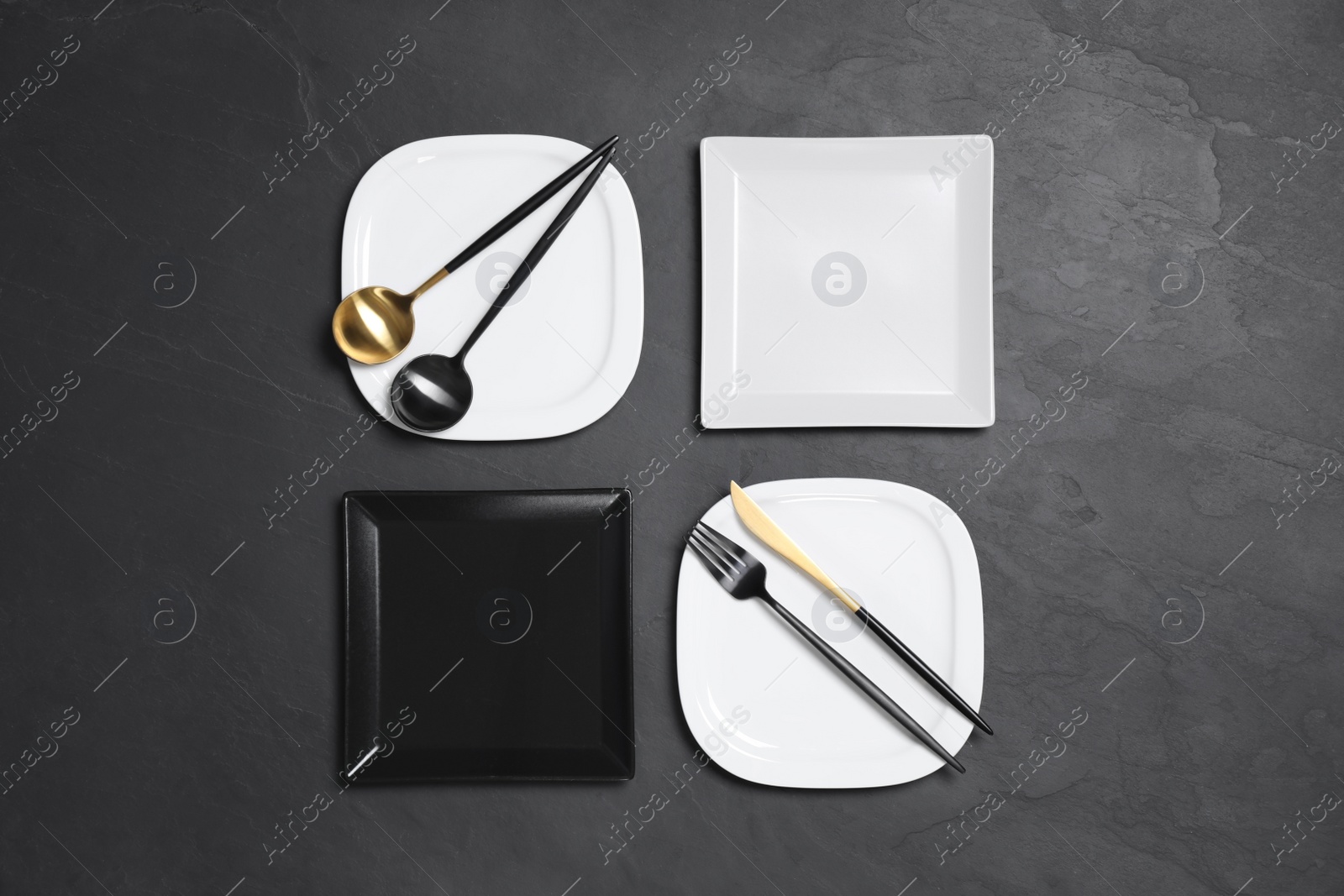 Photo of Flat lay composition with tableware on black background