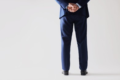 Businessman in leather shoes on white background, closeup