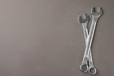 Auto mechanic's tools on grey background, flat lay. Space for text