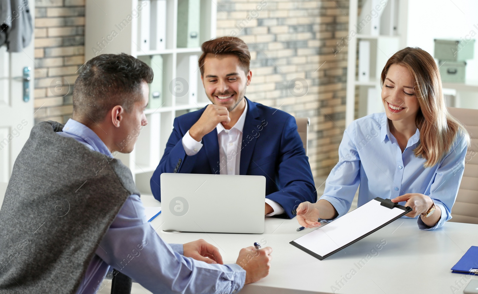 Photo of Human resources commission conducting job interview with applicant in office