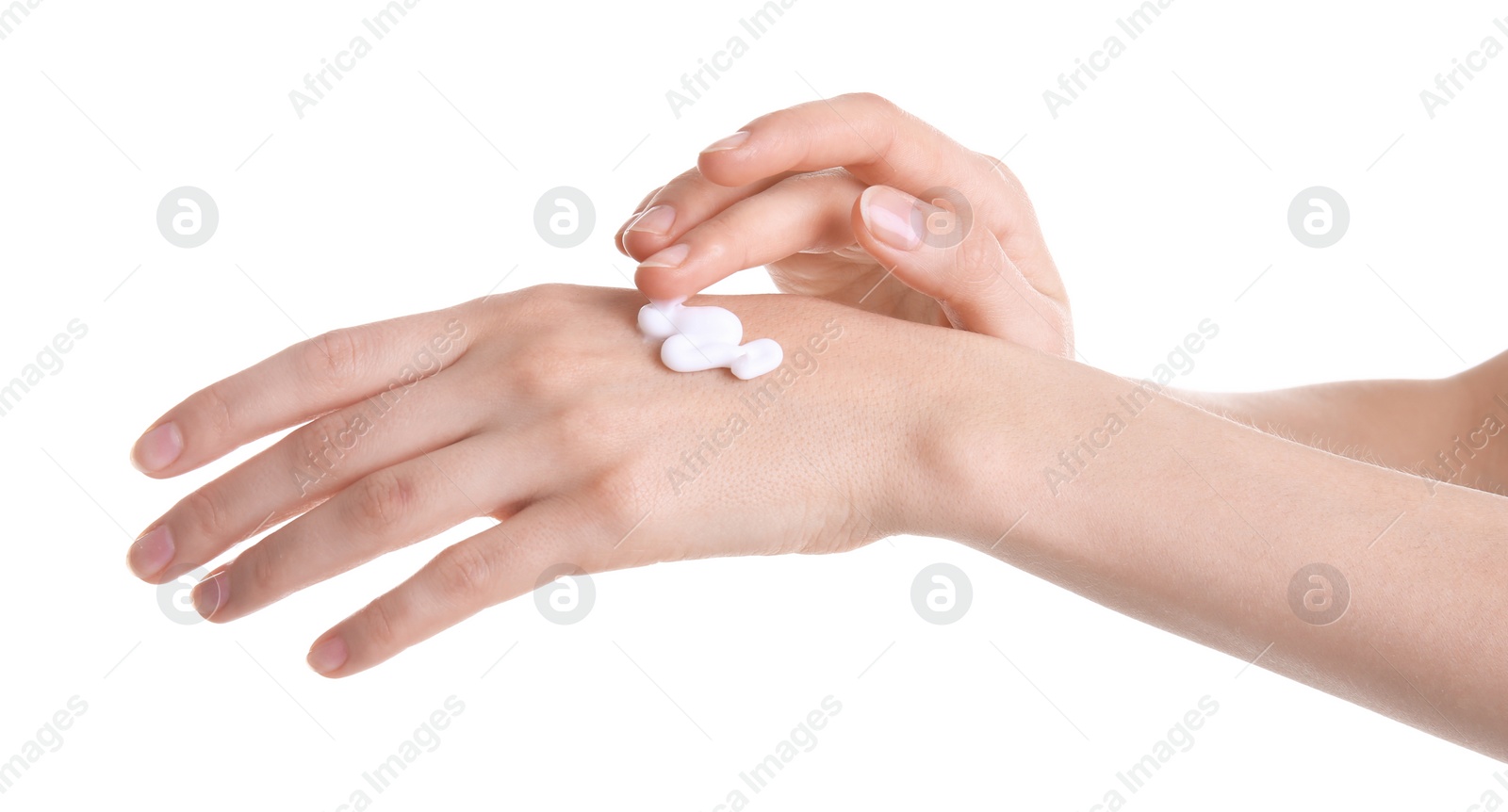 Photo of Young woman applying hand cream against on white background