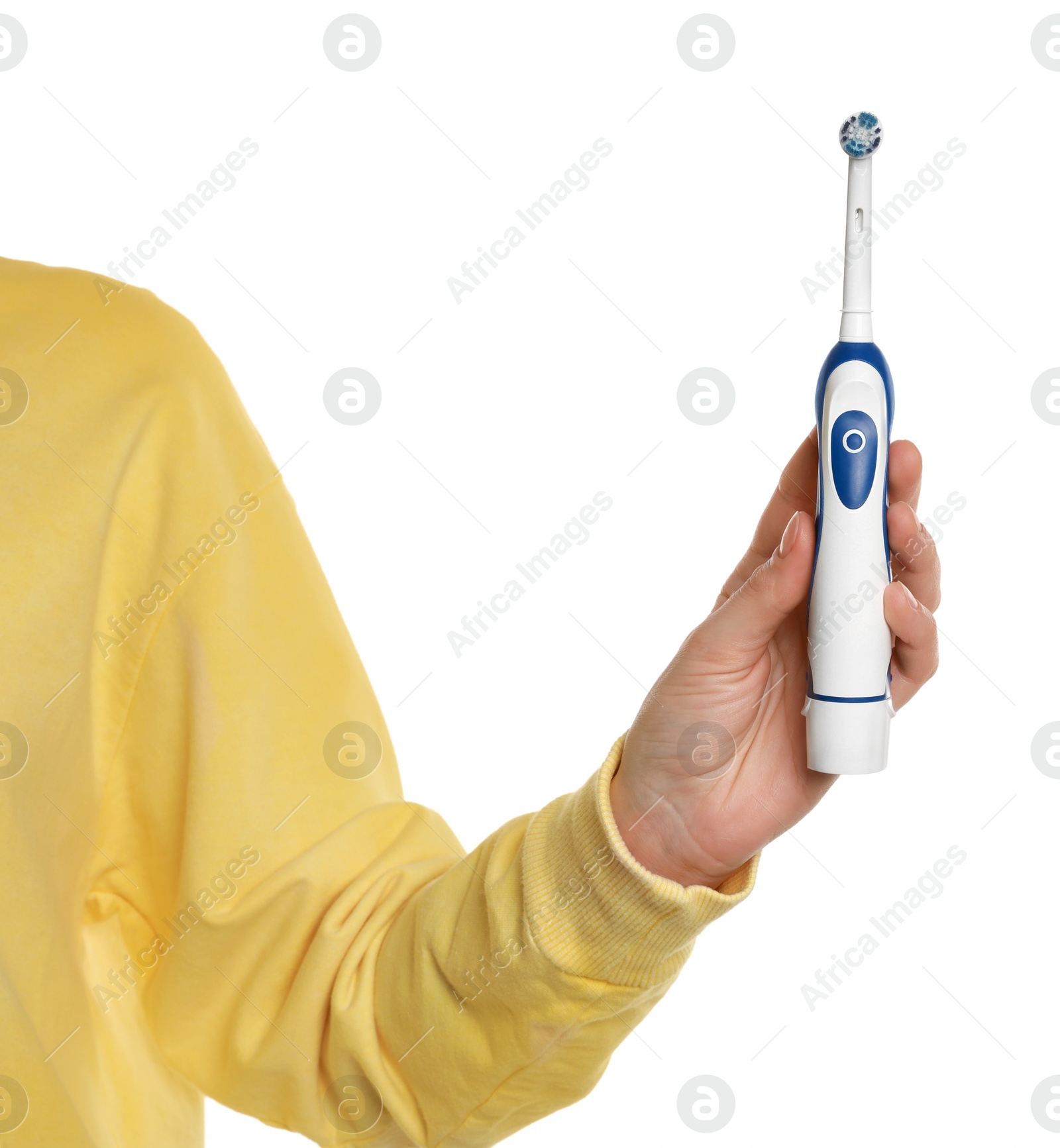 Photo of Woman holding electric toothbrush on white background, closeup