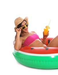 Photo of Beautiful young woman with inflatable ring and glass of cocktail on white background