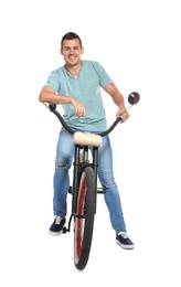 Portrait of handsome man with bicycle on white background