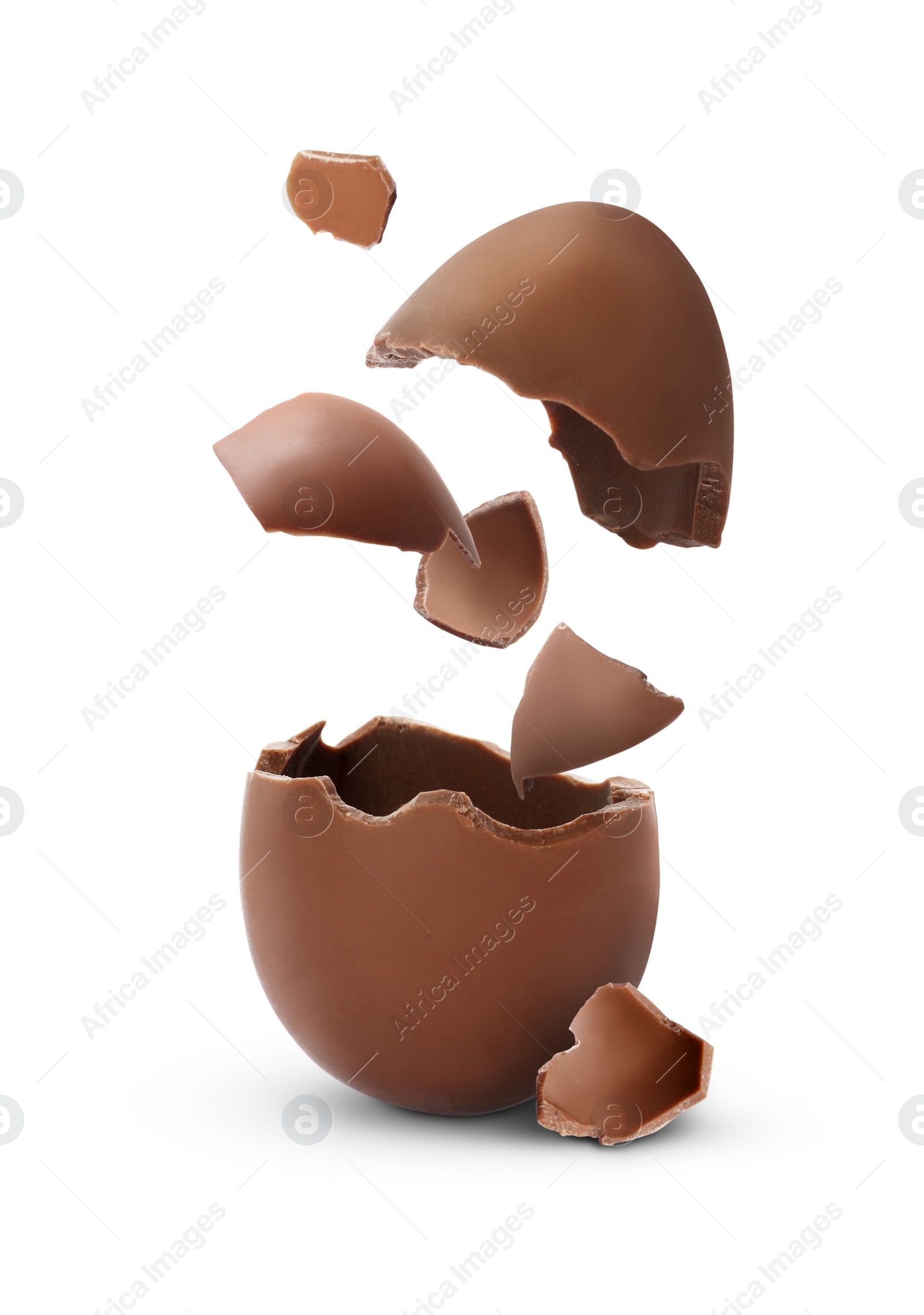 Image of Exploded milk chocolate egg on white background